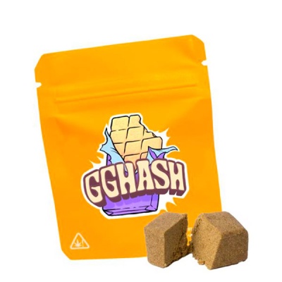 Embalagem amarela com texto GGHASH e produto compacto castanho