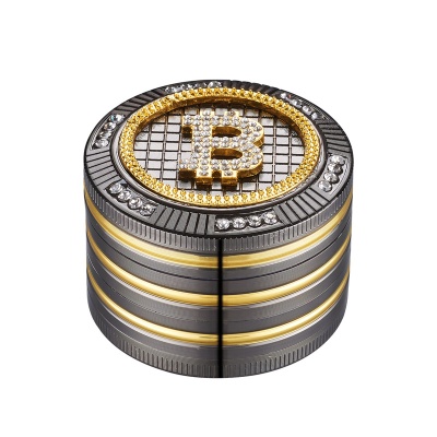 Objeto redondo cinza escuro e dourado com símbolo de Bitcoin e pedras brilhantes