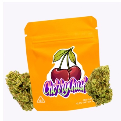 Embalagem amarela Cherry Kush com flores verdes ao lado