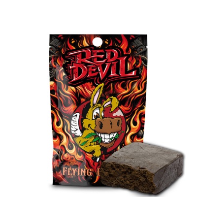 Embalagem RED DEVIL com desenho de chamas e burro sorridente, com bloco castanho escuro ao lado.
