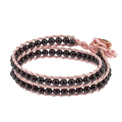 Pulseira de contas negras com fio rosa trançado