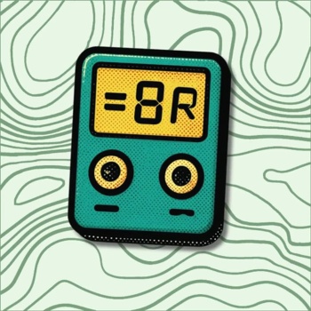 Dispositivo eletrônico verde com visor amarelo e dois botões redondos