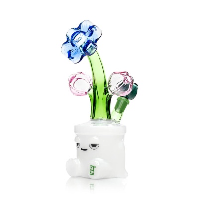 Objeto de vidro com base branca e flores coloridas em vidro