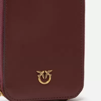 Carteira bordô com fecho dourado de pássaros entrelaçados