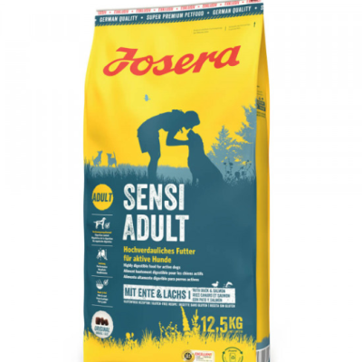Pacote amarelo de ração para cães Josera Sensi Adult 12,5 kg com silhueta de pessoa e cão.
