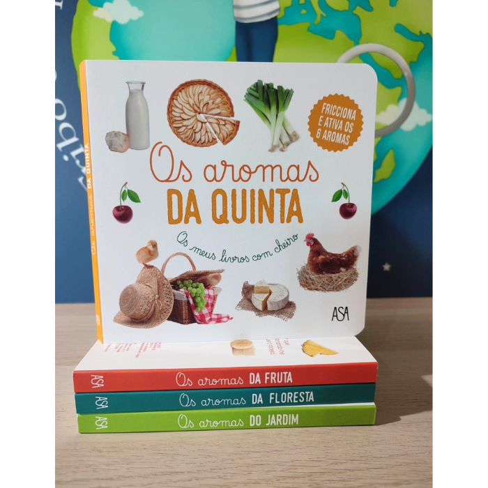 Os aromas da Quinta | ASA Conjunto de quatro livros sobre aromas com capas ilustradas, empilhados sobre mesa de madeira.
