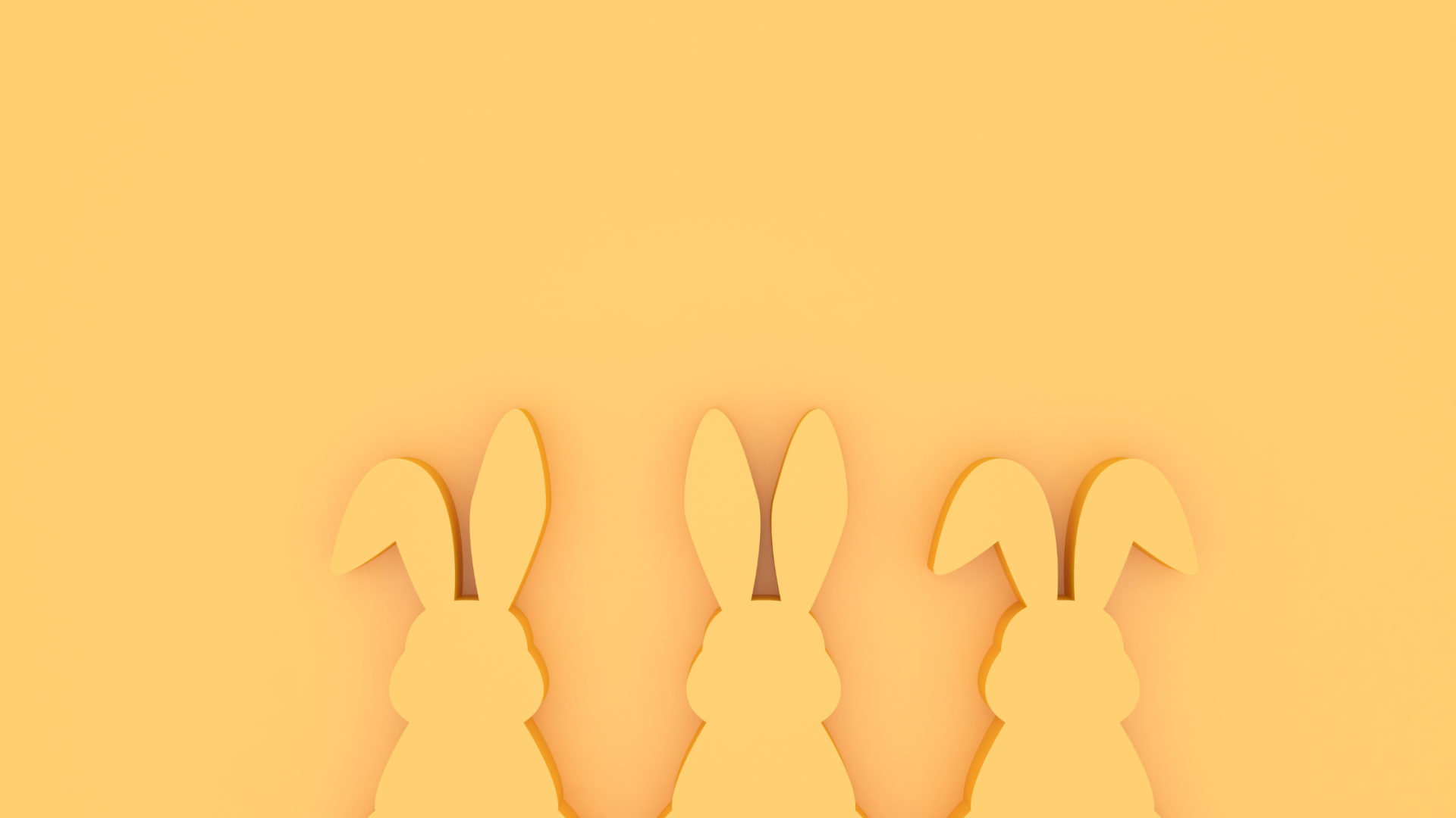 Três recortes de coelhos cor de laranja em fundo laranja