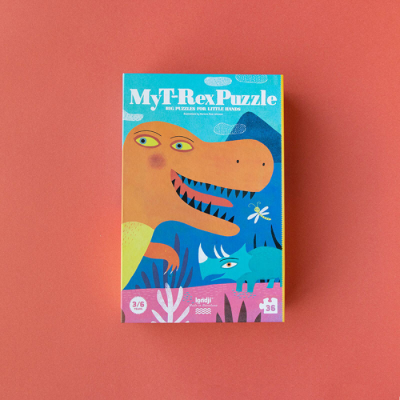 Embalagem de puzzle 'My T-Rex Puzzle' com ilustração colorida de dinossauros amarelo e azul