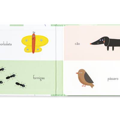 Livro aberto com imagens e nomes de animais: borboleta, formigas, cão e pássaro