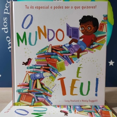 Capa de livro infantil com ilustração colorida e texto O MUNDO É TEU!