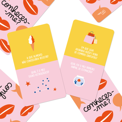Cartas de jogo de perguntas em cores amarelo e rosa com textos em português sobre preferências pessoais.