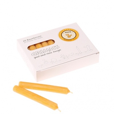 Caixa branca com 20 velas amarelas de cera de abelha e texto em alemão