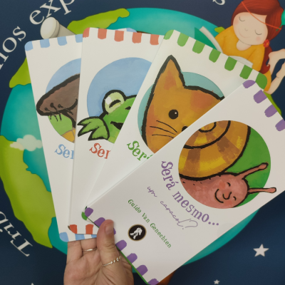 Quatro livros infantis coloridos com capas ilustradas mostrando um caracol, gato, sapo e cogumelo, título em português e autor Guido Van Genechten.