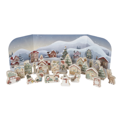 Figuras de madeira de uma vila de inverno com casas e personagens num cenário de neve