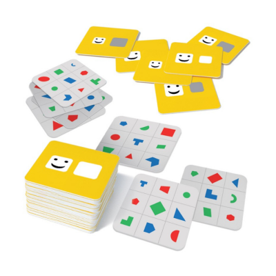 Cartões de jogo com símbolos geométricos coloridos e ícone sorridente em amarelo e branco