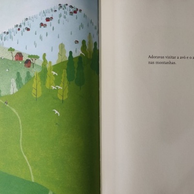 Ilustração colorida de montanhas e texto em português em páginas abertas de um livro