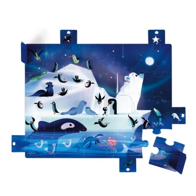 Peça de puzzle azul com animais marinhos e polares sob o céu estrelado