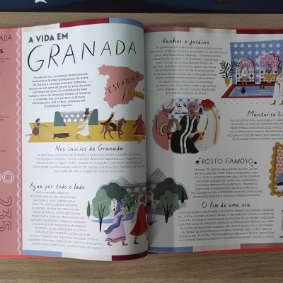 Livro aberto com texto e ilustrações coloridas sobre Granada, Espanha.