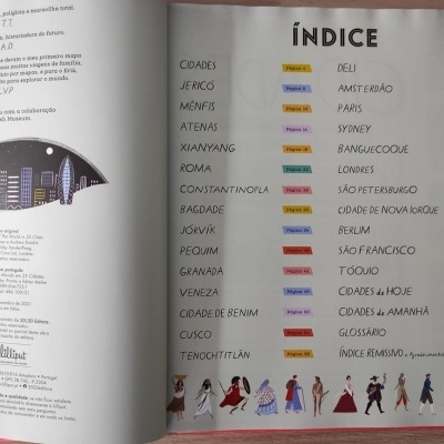 Índice de cidades e texto com ilustração de cidade à noite