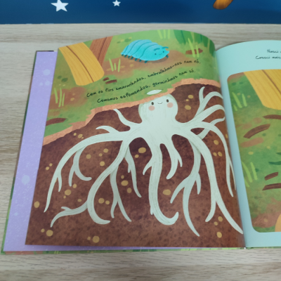 Ilustração colorida de livro infantil mostrando raiz branca sorridente e lagarta azul com texto em português