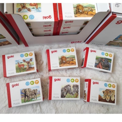 Caixas de puzzles goki com ilustrações de animais e informações de idade e número de peças.