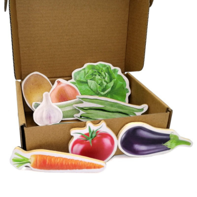 Ímanes de vegetais ilustrados numa caixa de cartão