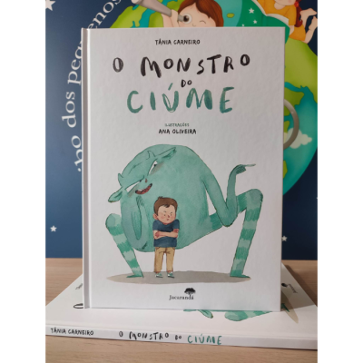 Livro infantil 'O Monstro do Ciúme' com ilustração de monstro e criança na capa