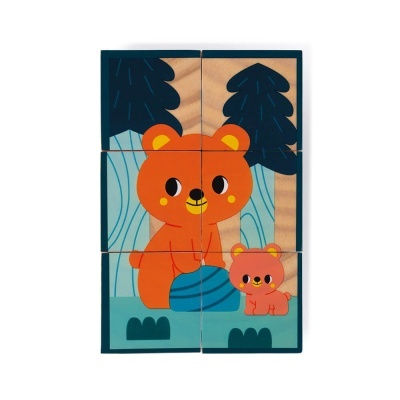 Blocos de madeira com desenho de ursos laranja em floresta azul