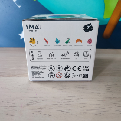 Caixa branca de produto STEAM com ícones coloridos e texto explicativo em português.