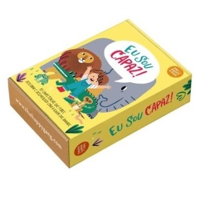 Caixa colorida com ilustração de menino e leão, texto Eu Sou Capaz!