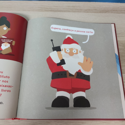Ilustração de Pai Natal com telefone num livro aberto