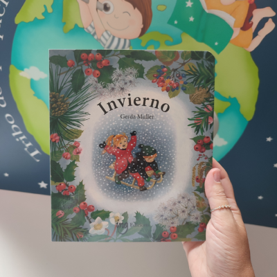 Capa do livro infantil 'Invierno' com ilustração de crianças na neve e flores coloridas