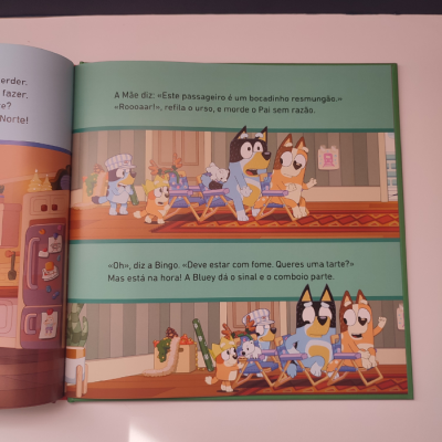 Página de livro infantil com cães animados e texto em português