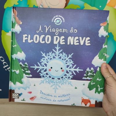 Capa de livro infantil 'A Viagem do Floco de Neve' com ilustração de floco de neve e natureza