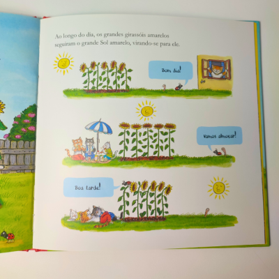 Página ilustrada de livro infantil com girassóis e animais a falar em português.
