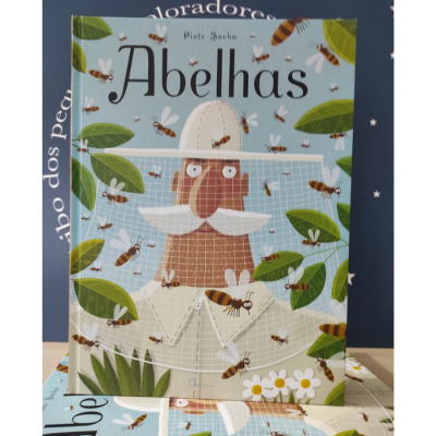 Capa do livro Abelha mostrando apicultor, abelhas, folhas e flores