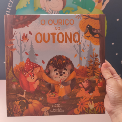 Livro infantil ilustrado com tema de outono e um ouriço no centro