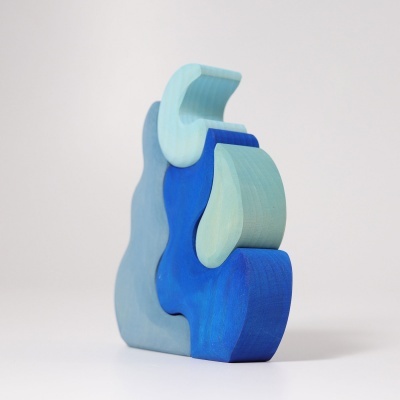 Peça decorativa de madeira azul em três partes encaixadas