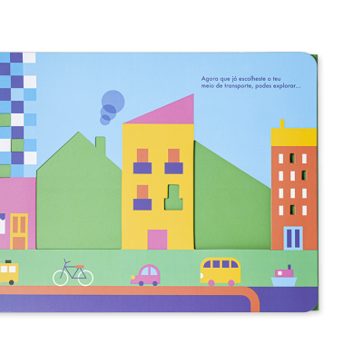 Livro infantil com capa colorida mostrando prédios e veículos desenhados
