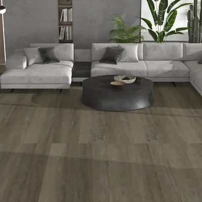 GRIT 1300 MORNA — Pavimento SPC Série VIVA Sofá modular cinza com almofadas, mesa de centro preta, plantas e chão de madeira