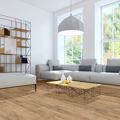 Modern living room with gray sofa and ottoman, yellow and black coffee table, metal shelving unit, wooden floor, large windows, and white pendant lamp