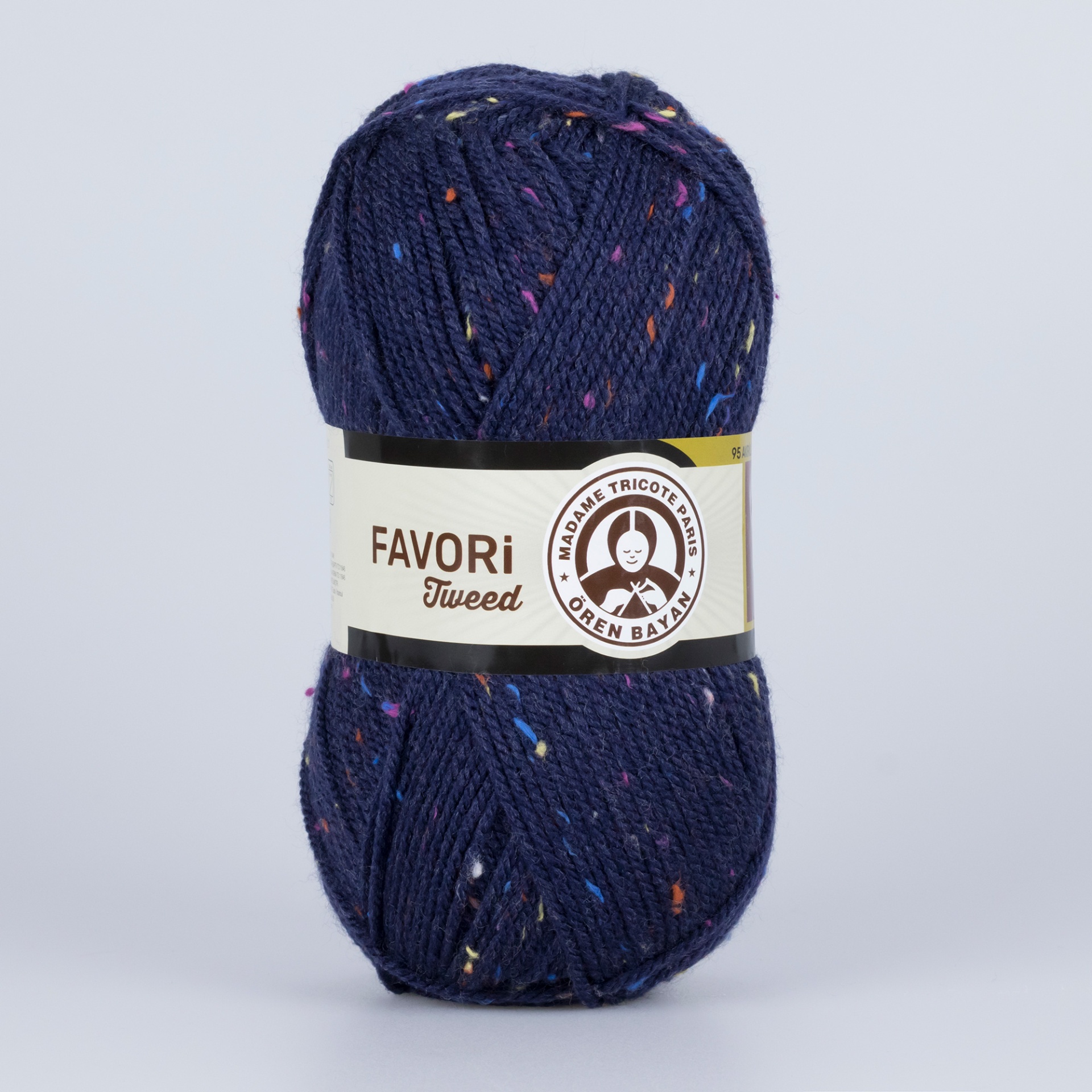 Novelo de lã azul escura com manchas coloridas e etiqueta FAVORI Tweed