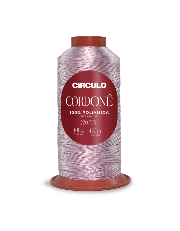 Rolo de linha rosa pálido com etiqueta vermelha indicando 100% poliamida e 450 metros.