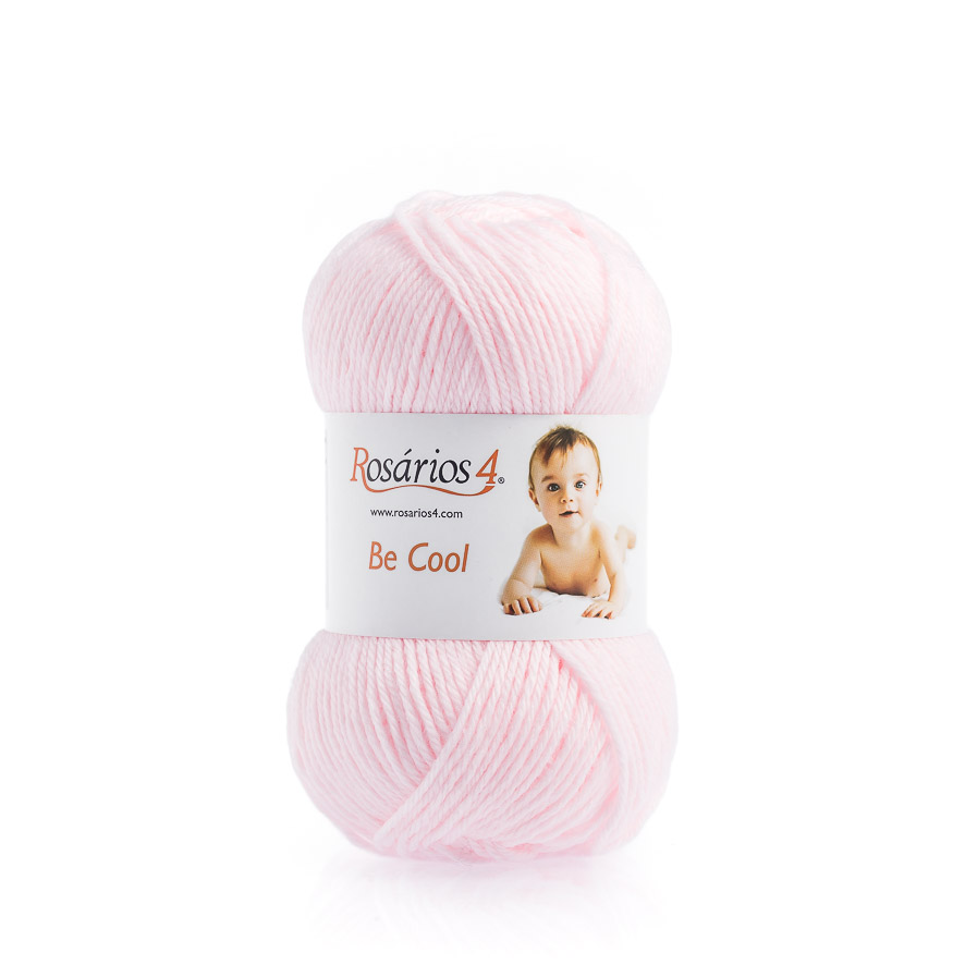 Novelo de lã rosa claro com rótulo branco e imagem de bebé
