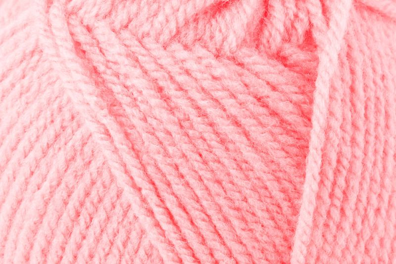 Novelo de lã cor-de-rosa em close-up