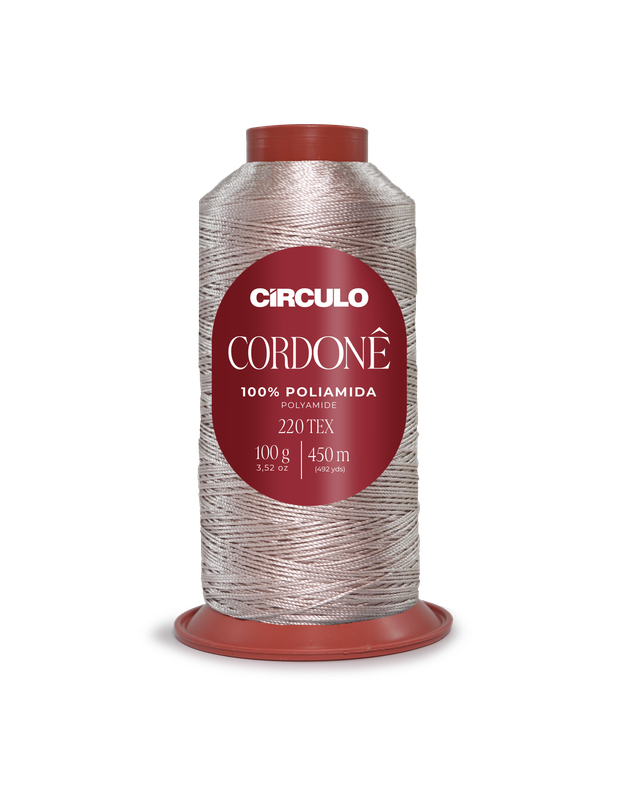 Rolo de linha CORDONÊ prata com etiqueta vermelha e base plástica