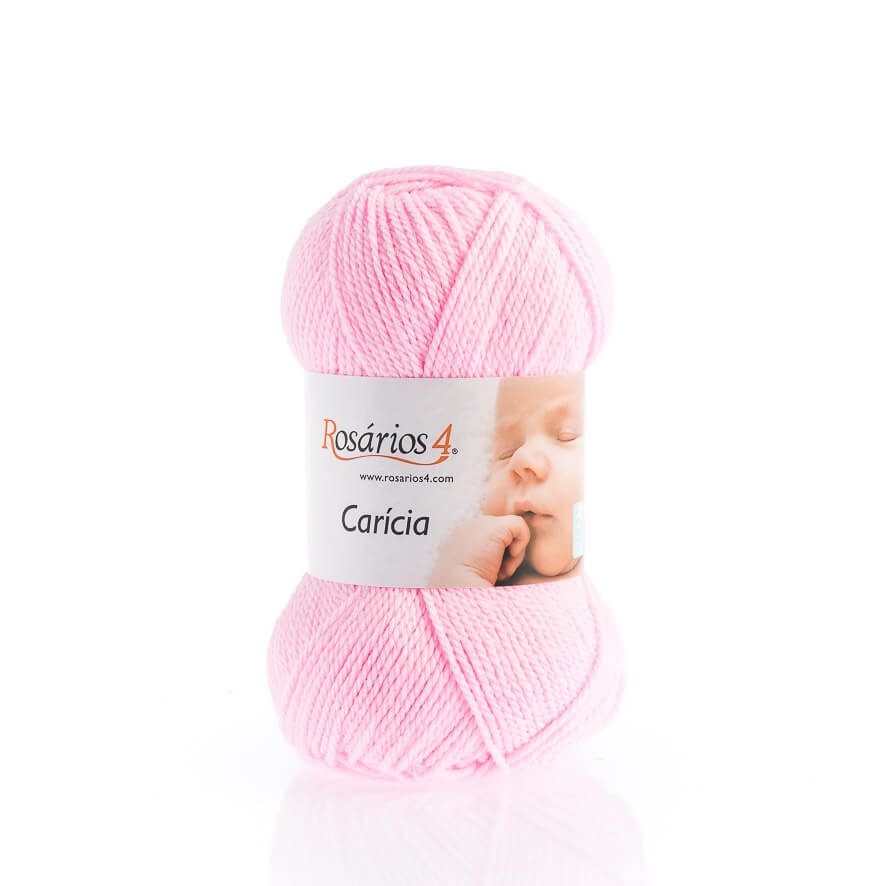 Novelo de lã rosa claro com etiqueta 'Rosários 4 Carícia' e imagem de bebé