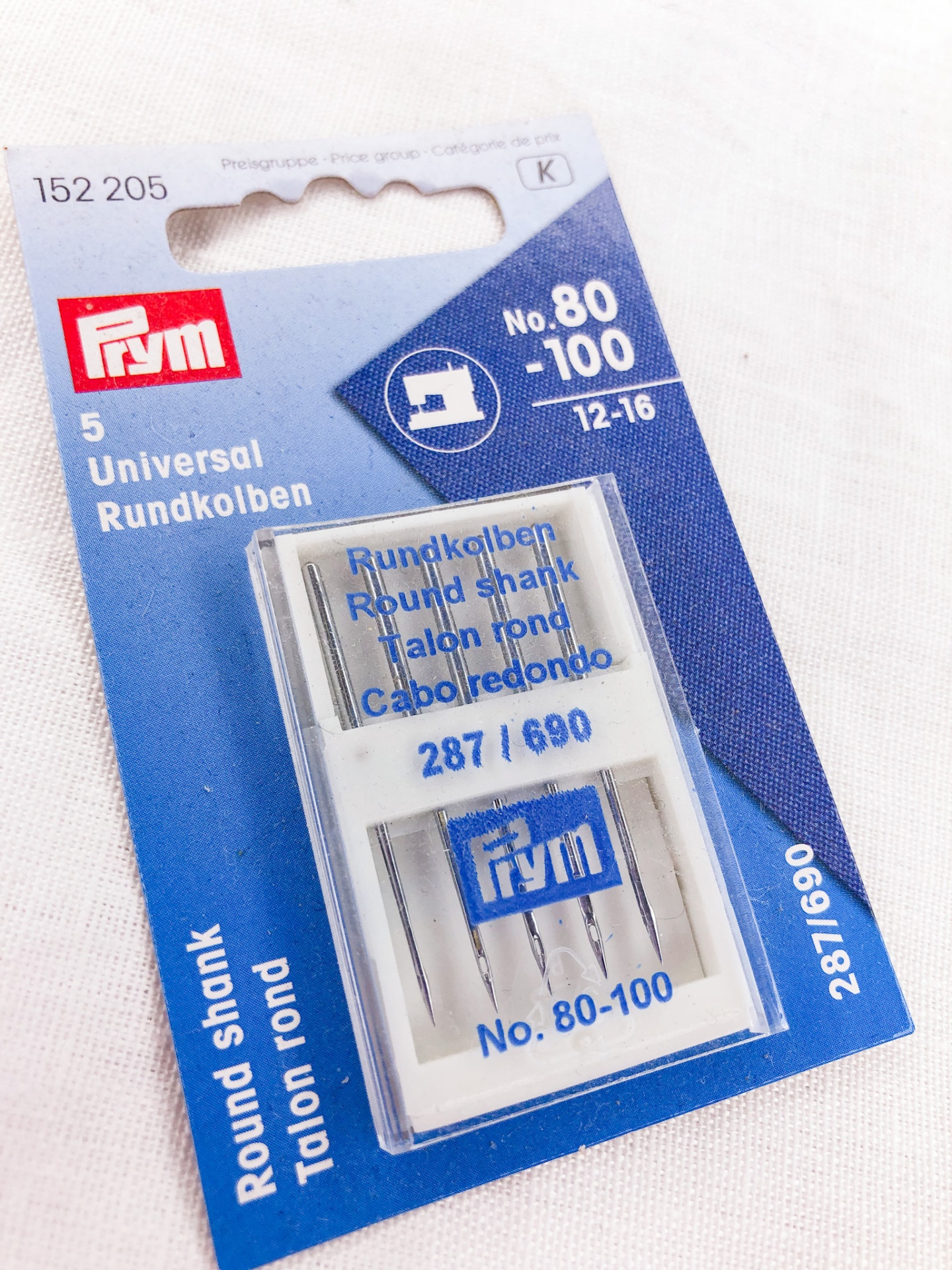 Embalagem azul e branca com cinco agulhas universais de ponta redonda Prym No. 80-100