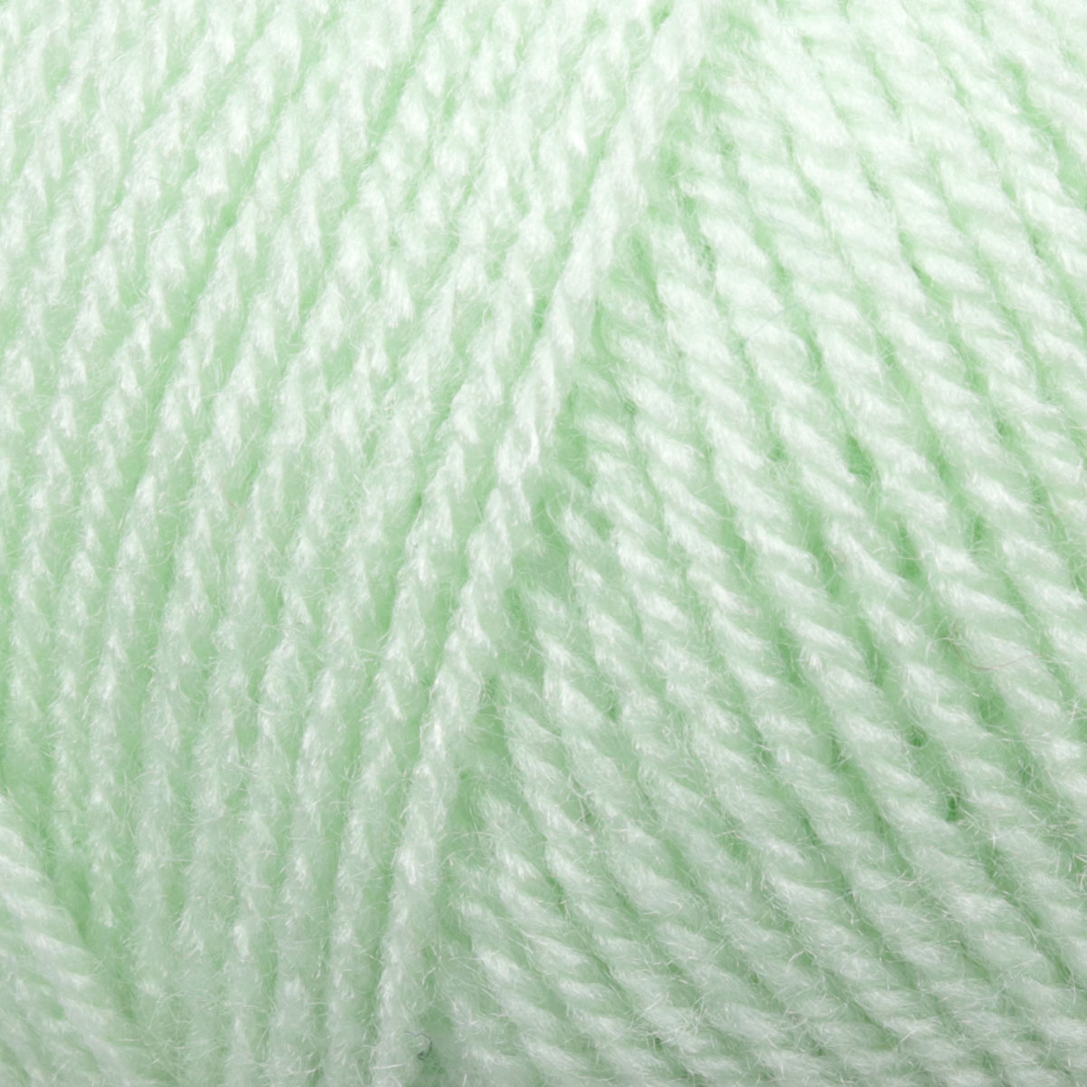 Novelo de lã verde claro com textura suave em close-up