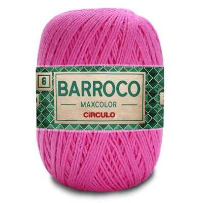 Novelo de fio rosa com etiqueta verde e dourada